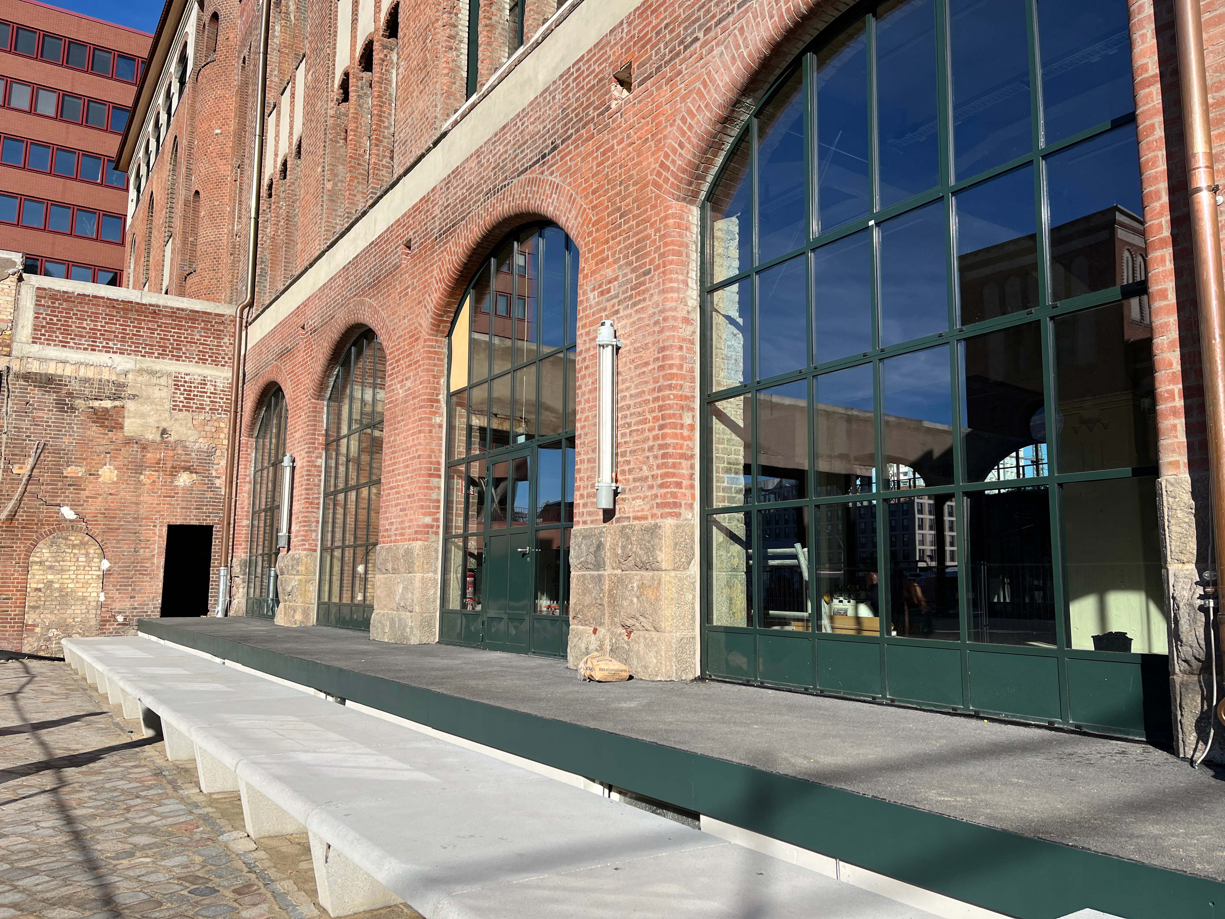 Exterior view of construction progress at Berlin's Postbahnhof station, looking toward the departure packing room.